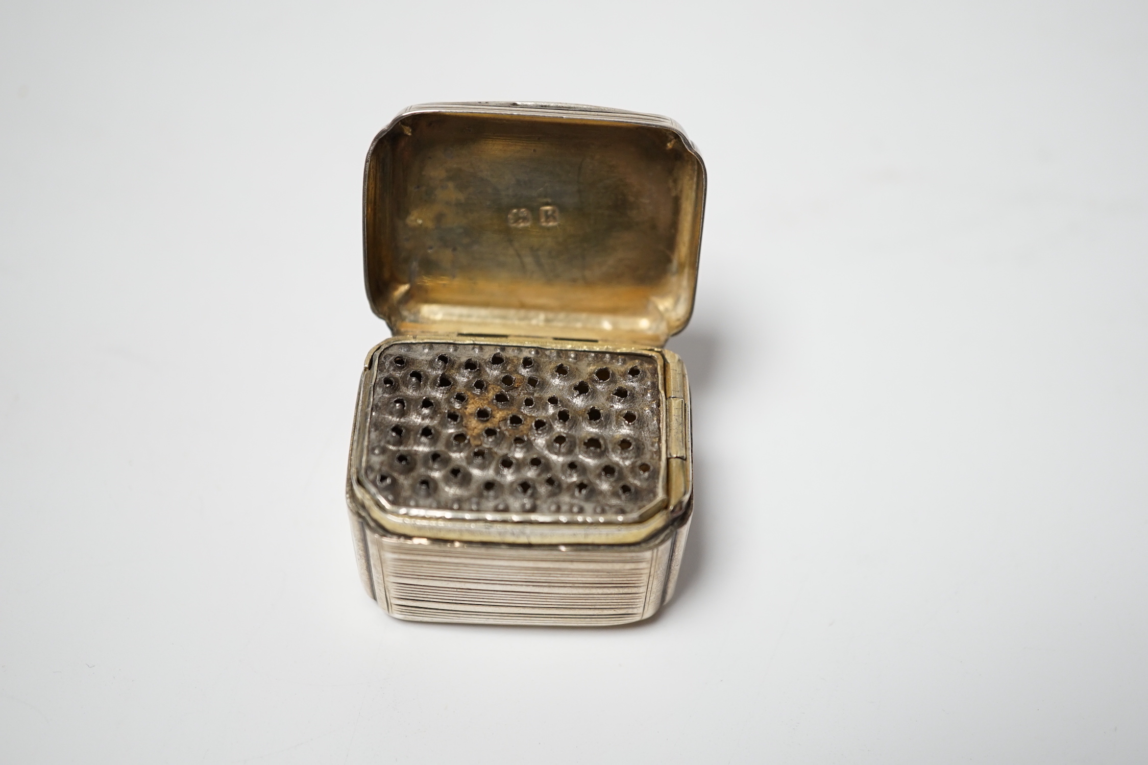 A George III reeded silver nutmeg grater, maker's mark rubbed, London 1812, 37mm.